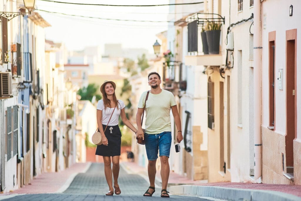 Couple exploring a charming European village during their first customized vacation to Europe.